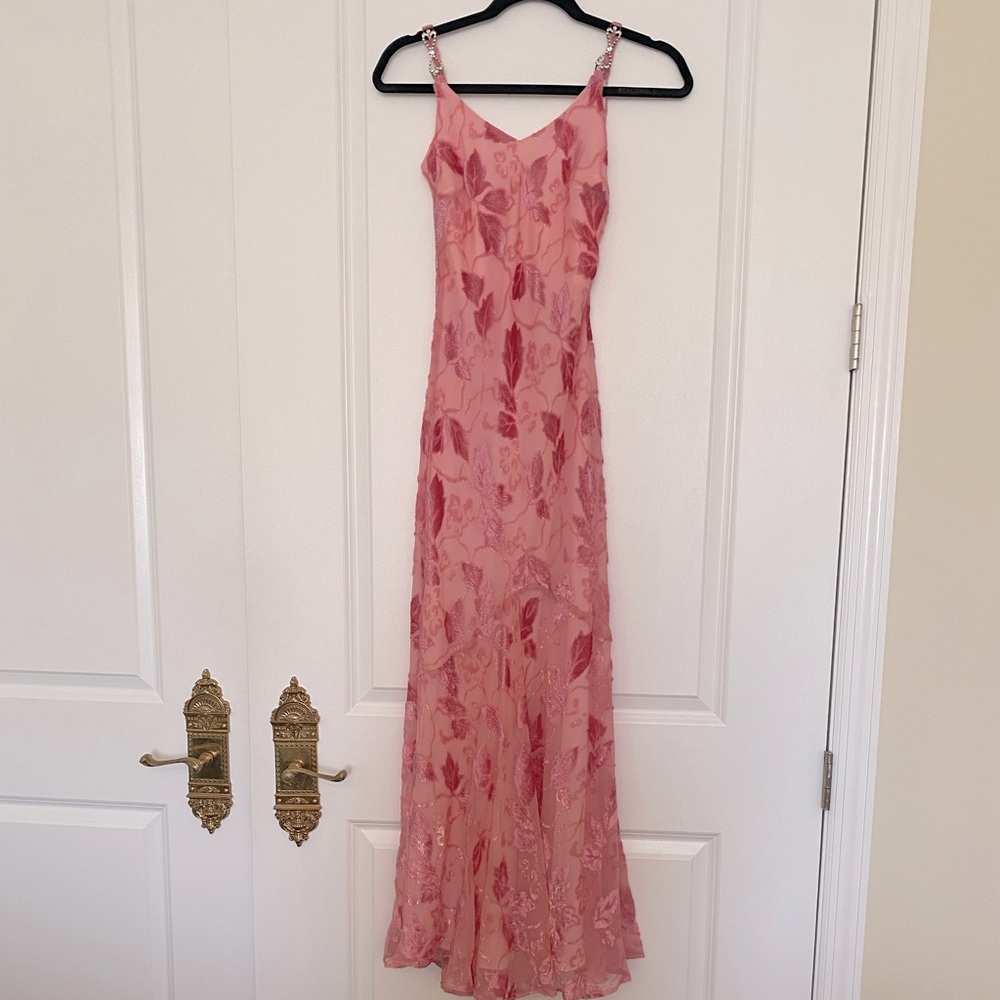 Pink leaf gown with velvet detail and rhinestone shoulder straps.